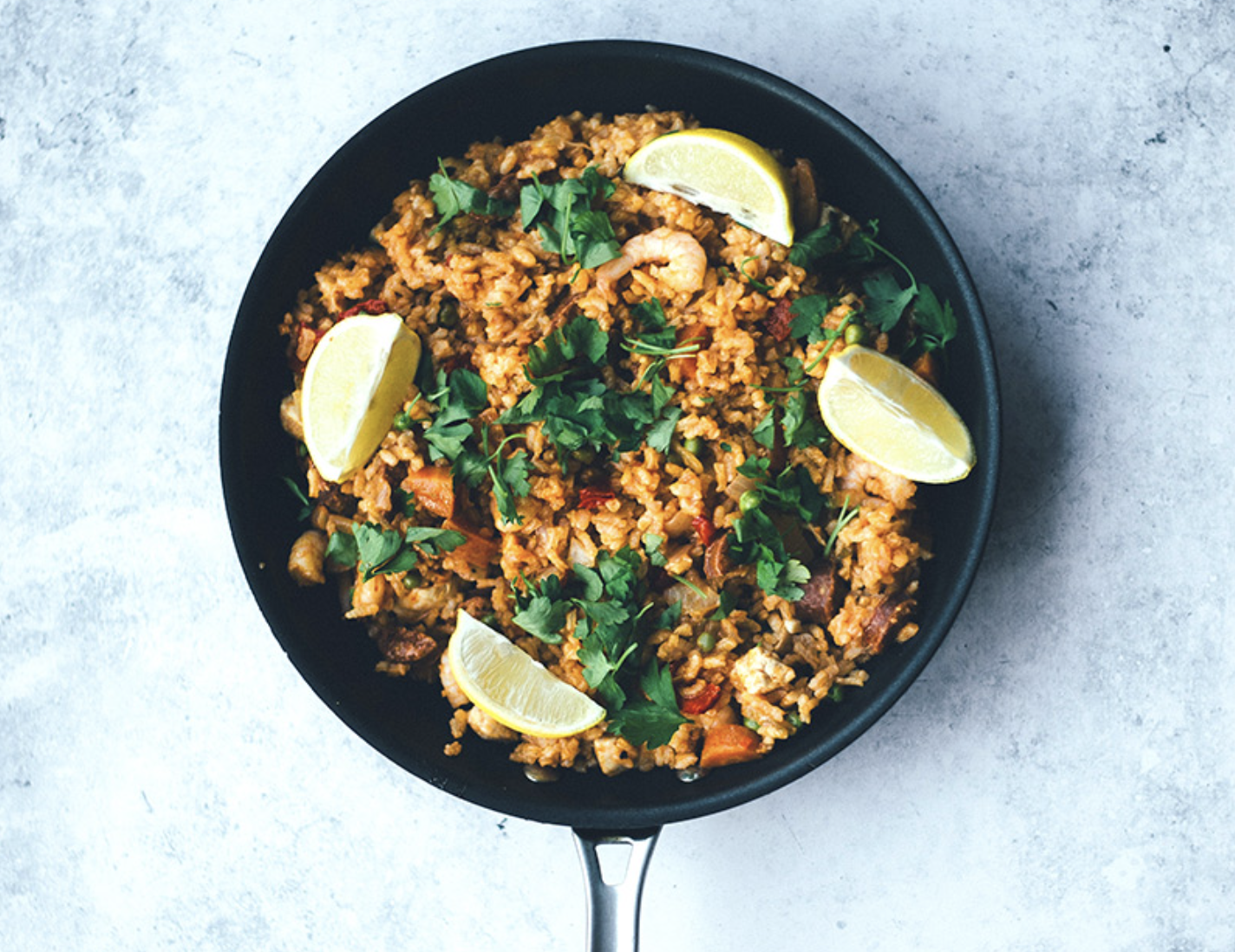 stir fried brown rice in a skillet